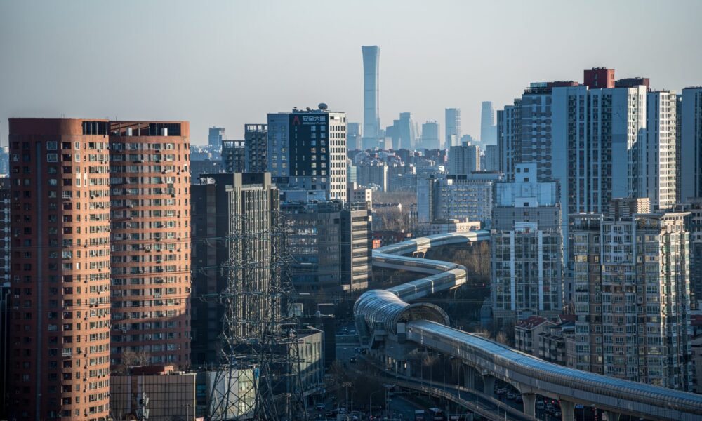 A subway line is going through a dense urban quarter.